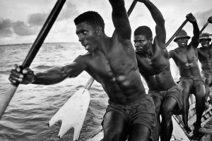 Ghana, 1960. The boatmen chant as they paddle.