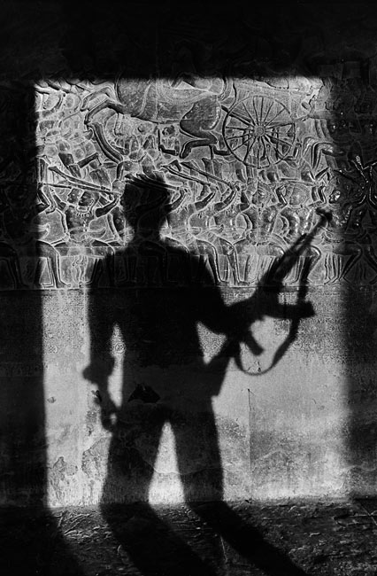 Shadow of a soldier on the bas-reliefs of Angkor Vat, 1990