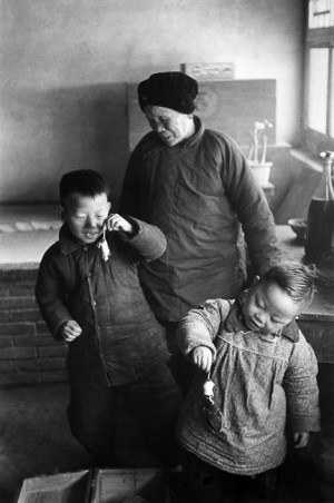 Children playing with mice, suburb of Beijing, 1957